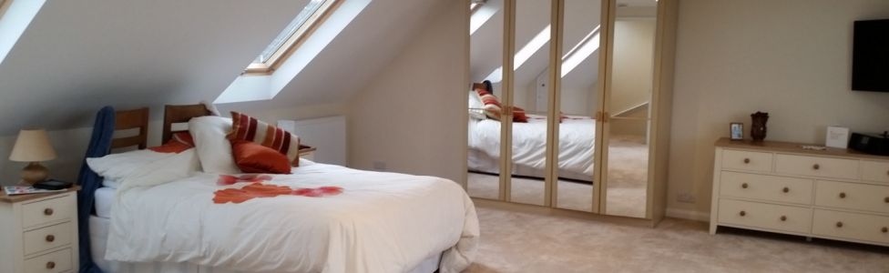 Inside a bedroom in a loft conversion Inside a bedroom in a loft conversion