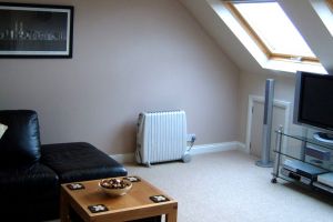 A loft converted into a relaxing living space A loft converted into a relaxing living space