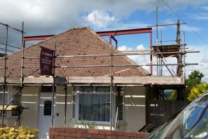 An external view of a loft conversion in progress